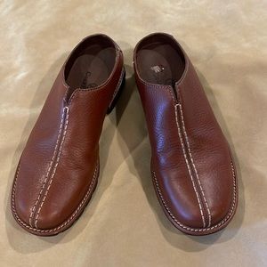 Reddish brown Cole Haan mules. 5B